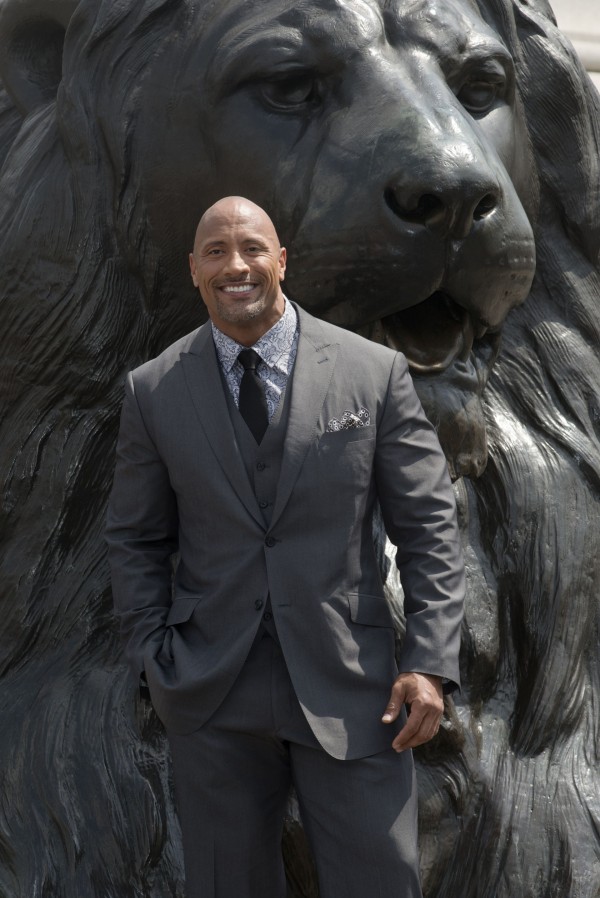 Dwayne Johnson aka The Rock poses with a lion in Trafalgar Square