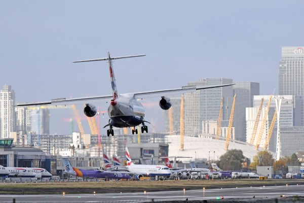 A BA plane battles the winds to land safely at London City Airport (Victoria Jones/PA)