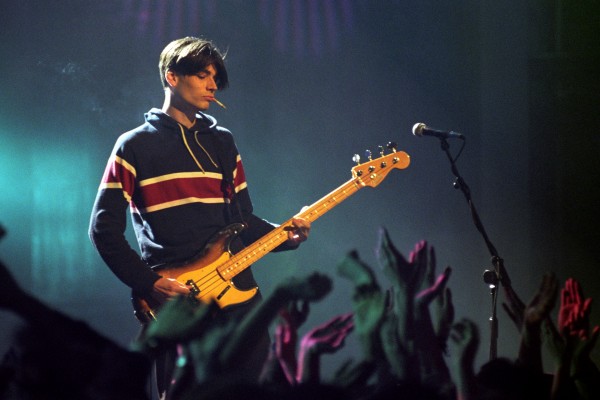 Blur bassist Alex James performing on stage at the 1995 Brit Awards ceremony at London's Alexandra Palace