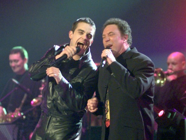 Tom Jones and Robbie Williams on stage at the Brit Awards at the london Arena this evening 