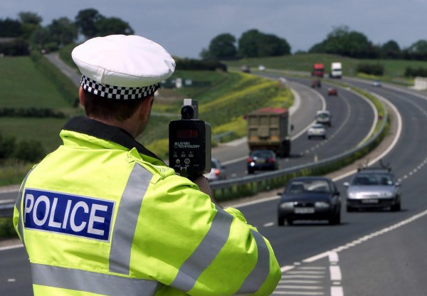 Police monitoring speeding cars.