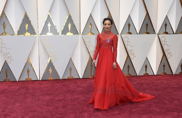 Ruth Negga, wearing the ACLU ribbon, arrives at the Oscars on Sunday, Feb. 26, 2017, at the Dolby Theatre in Los Angeles. (Photo by Matt Sayles/Invision/AP)