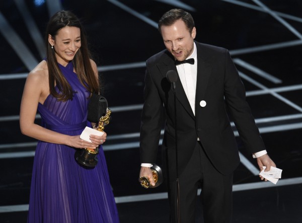 Joanna Natasegara, left, and Orlando von Einsiedel accept the award for best documentary short (Chris Pizzello/Invision/AP)