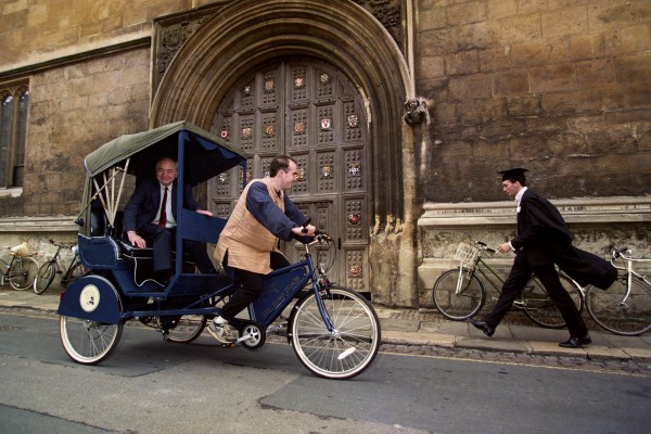 Colin Dexter takes a rickshaw ride in Oxford.