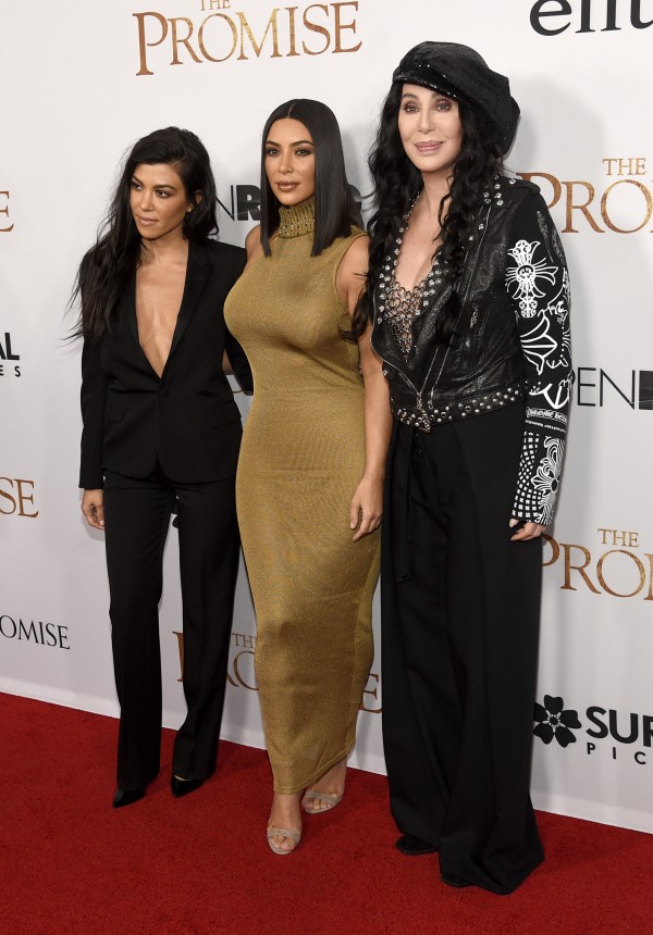 Kourtney Kardashian, Kim Kardashian West and Cher arrive at the US premiere of The Promise