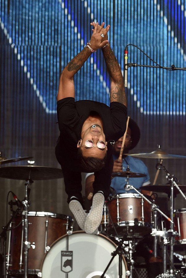 Aston Merrygold performs a backflip on stage during Fusion Festival 2015 at Cofton Park, Birmingham