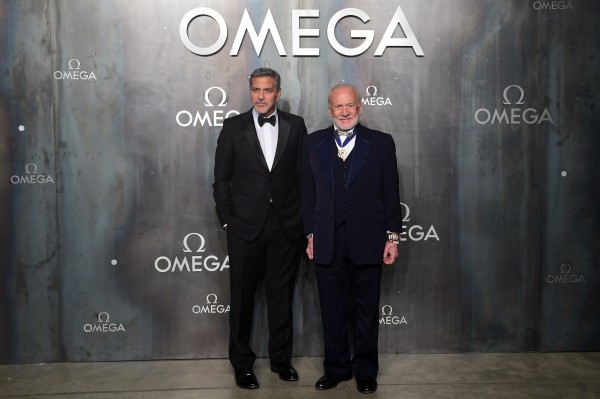 George Clooney and Buzz Aldrin (right) attending the Lost in Space event to celebrate the 60th anniversary of the OMEGA Speedmaster held in the Turbine Hall, Tate Modern, 25 Sumner Street, Bankside, London.