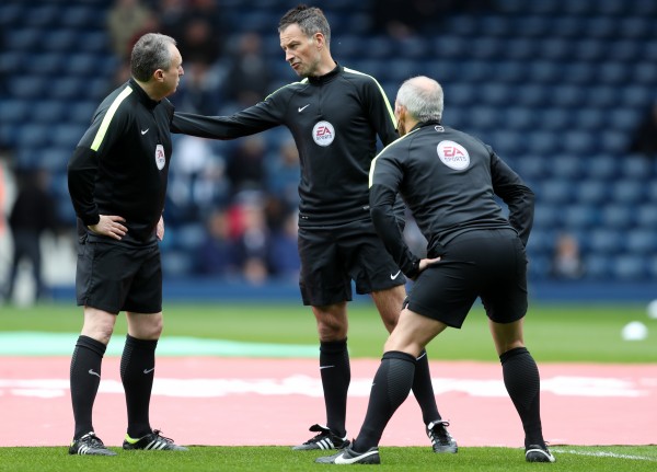 Clattenburg and officials stretching