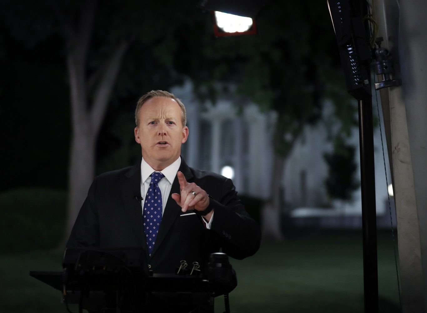 White House press secretary Sean Spicer talks to media in front of the White House, in Washington, Tuesday, May 9, 2017. 