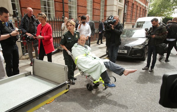 BBC cameraman Giles Wooltorton is loaded into an ambulanceBBC cameraman Giles Wooltorton is loaded into an ambulance