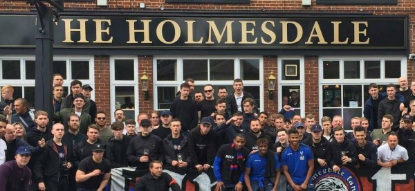 The players with the fans outside the pub