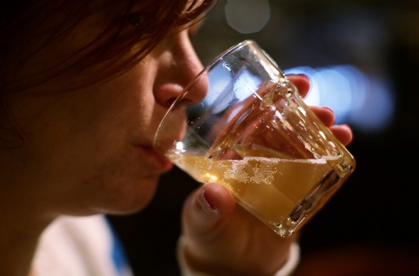 Woman drinks alcohol