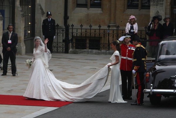 Kate Middleton waves as she arrives at Westminster Abbey where she is helped with her dress by her sister Pippa ahead of her wedding with Prince William (Carey Tompsett/PA)