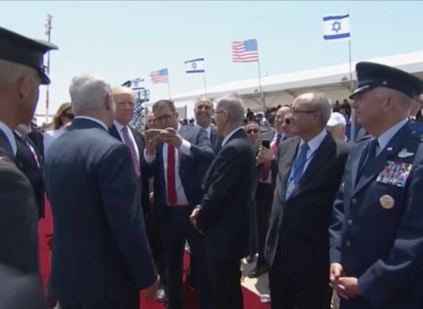 Oren Hazan, an Israeli lawmaker prepares to take a selfie with U.S. President Donald Trump