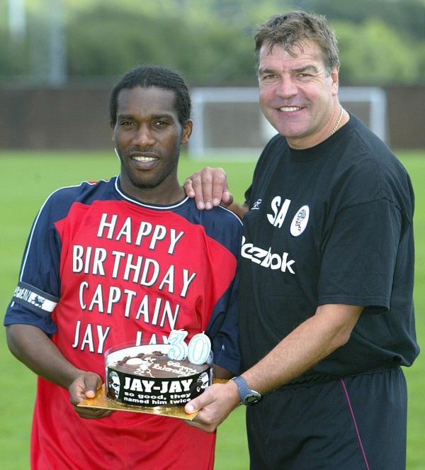 Bolton Wanderers' Jay Jay Okocha is presented with a birthday cake