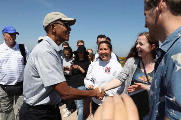 Obama shakes hands with a specatator