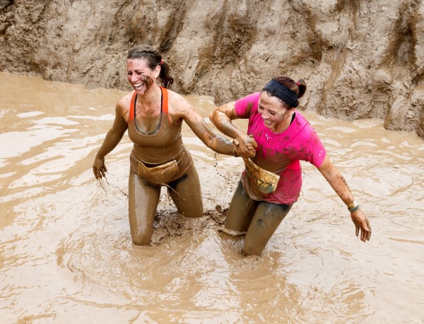 Participants take part in a Tough Mudder event race at Drumlanrig Castle