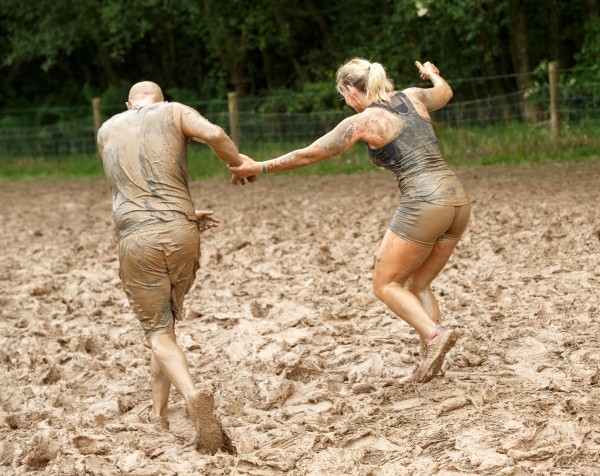 Participants take part in a Tough Mudder event race at Drumlanrig Castle