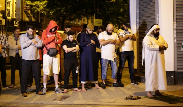 Local people observe prayers at Finsbury Park (Yui Mok/PA)