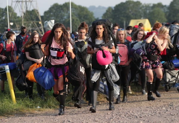 Festivalgoers arrive for the Glastonbury Festival at Worthy Farm in Pilton, Somerset (Yui Mok/PA)