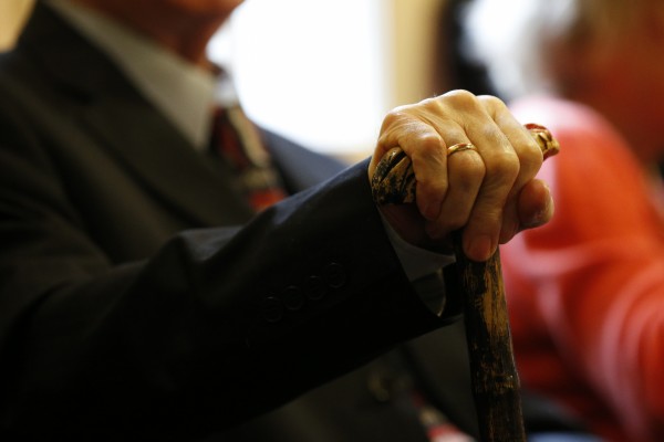 An elderly man with a walking stick (Jonathan Brady/PA)