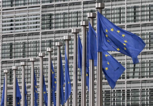 EU flags fly at the European Commission headquarters in Brussels