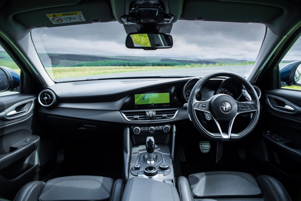 The Alfa's interior offers an excellent driving position 