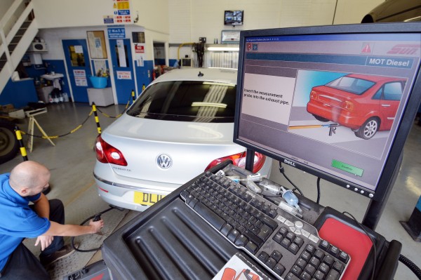 A Volkswagen Passat CC car is tested for its exhaust emissions, at a MOT (Ministry of Transport) testing station in Walthamstow, London (PA)