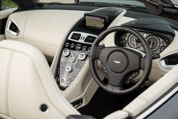 The Aston's interior is let down by a low-tech infotainment system